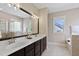 Bright bathroom with double sink vanity, soaking tub and glass enclosed shower at 5605 Cary Glen Blvd, Cary, NC 27519