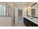 Bathroom showing a glass enclosed shower and double sink vanity at 5605 Cary Glen Blvd, Cary, NC 27519