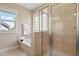 Well-lit bathroom showcasing a soaking tub and glass enclosed shower at 5605 Cary Glen Blvd, Cary, NC 27519