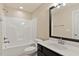 Clean bathroom with tub shower, single sink vanity, and toilet at 5605 Cary Glen Blvd, Cary, NC 27519