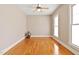 Spacious bedroom with hardwood floors, large windows, and neutral paint at 5605 Cary Glen Blvd, Cary, NC 27519