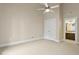 Neutral bedroom with closet, trim details and entry to bathroom at 5605 Cary Glen Blvd, Cary, NC 27519