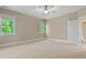 Bedroom with two windows, carpet floors, a ceiling fan and a neutral color scheme at 5605 Cary Glen Blvd, Cary, NC 27519