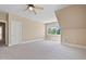 Spacious bedroom with dormer window, carpet floors, and door to ensuite bathroom at 5605 Cary Glen Blvd, Cary, NC 27519