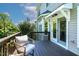 Private outdoor deck with comfortable chair and entrance into the home at 5605 Cary Glen Blvd, Cary, NC 27519
