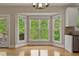Bright dining area featuring a bay window and light-colored flooring at 5605 Cary Glen Blvd, Cary, NC 27519