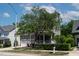 A charming two-story home with a well-maintained front lawn and a cozy front porch, framed by mature trees at 5605 Cary Glen Blvd, Cary, NC 27519