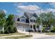 Charming two-story home with a two-car garage, manicured lawn, and inviting front porch at 5605 Cary Glen Blvd, Cary, NC 27519