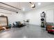 Spacious garage featuring epoxy flooring and ample space for parking and storage at 5605 Cary Glen Blvd, Cary, NC 27519