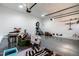 Spacious garage featuring epoxy flooring and ample space for parking and storage at 5605 Cary Glen Blvd, Cary, NC 27519
