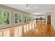 Open living room area with hardwood floors, natural light, and view of the kitchen at 5605 Cary Glen Blvd, Cary, NC 27519
