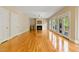 Spacious living room with fireplace, hardwood floors and glass doors leading to a deck at 5605 Cary Glen Blvd, Cary, NC 27519