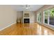 Living area showcasing fireplace, bright windows, and open space at 5605 Cary Glen Blvd, Cary, NC 27519