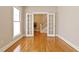 Bright office with hardwood floors and glass doors leading to the foyer at 5605 Cary Glen Blvd, Cary, NC 27519