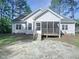Charming home with a stone patio, screened porch and backyard surrounded by trees at 62 Sailfish Ct, Clayton, NC 27520