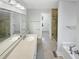 Updated bathroom with stone countertop and walk-in shower at 62 Sailfish Ct, Clayton, NC 27520