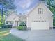 Charming home with a two-car garage, landscaped yard, and covered front porch at 62 Sailfish Ct, Clayton, NC 27520