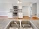 Double sink view of stainless steel appliances, and white cabinetry in the kitchen at 62 Sailfish Ct, Clayton, NC 27520