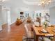 Spacious living room and dining area with hardwood floors and modern decor, virtually staged at 62 Sailfish Ct, Clayton, NC 27520