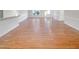 An open-concept living room with light hardwood flooring and bright, airy natural lighting at 62 Sailfish Ct, Clayton, NC 27520