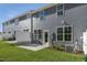 Gray siding on townhomes with concrete patios and green grass at 714 Andrade Dr, Fuquay Varina, NC 27526