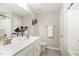 Modern bathroom with double sink vanity, granite countertops, and neutral colored walls at 717 Silo Park Dr, Wake Forest, NC 27587