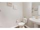 A clean powder room features a pedestal sink and a white toilet at 717 Silo Park Dr, Wake Forest, NC 27587