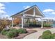 Covered picnic tables and grilling area by a community pool at 717 Silo Park Dr, Wake Forest, NC 27587
