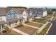 Charming townhomes featuring manicured lawns and inviting porches with seating areas at 717 Silo Park Dr, Wake Forest, NC 27587