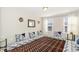 Comfortable sitting room featuring a decorative rug and pillow seating under large windows at 717 Silo Park Dr, Wake Forest, NC 27587