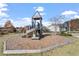 playground with slide and playhouse in a safe, wood-chipped environment at 717 Silo Park Dr, Wake Forest, NC 27587