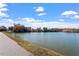 View of a scenic pond surrounded by foliage, showcasing the natural beauty at 717 Silo Park Dr, Wake Forest, NC 27587