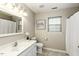 Neutral bathroom featuring white vanity, toilet, and shower-tub combo at 732 Westview Ct, Nashville, NC 27856