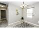 Dining room features tile floor, modern chandelier, and plenty of light from the window at 732 Westview Ct, Nashville, NC 27856