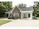 Charming brick and vinyl home with a well-manicured lawn and landscaping at 732 Westview Ct, Nashville, NC 27856