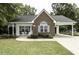Charming brick and siding home featuring a well-manicured lawn and an inviting carport at 732 Westview Ct, Nashville, NC 27856