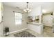 Eat-in kitchen with open design, tile floor, breakfast bar, and plenty of natural light at 732 Westview Ct, Nashville, NC 27856