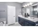 Elegant bathroom with dual vanity, modern fixtures, and a sleek, stylish design at 756 Bachelor Gulch Way, Apex, NC 27523