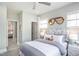 Charming bedroom with bright natural light, a stylish headboard and playful decorations at 756 Bachelor Gulch Way, Apex, NC 27523