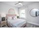 Cozy bedroom featuring colorful rainbow decor, soft lighting, and a comfortable, inviting space at 756 Bachelor Gulch Way, Apex, NC 27523