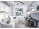 Bright office space featuring white shiplap walls, modern decor, and comfortable seating at 756 Bachelor Gulch Way, Apex, NC 27523