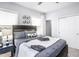 Comfortable bedroom with stylish decor, including a sports-themed comforter and decorative soccer balls at 760 Bachelor Gulch Way, Apex, NC 27523