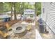 A generous backyard that includes a fire pit, patio, a back deck, and a lush green landscape at 918 Orient St, Durham, NC 27701