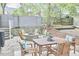 Well-maintained backyard featuring a fire pit, flagstone patio, and outdoor seating for entertaining at 918 Orient St, Durham, NC 27701