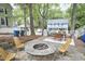 Spacious backyard boasting a fire pit, an outdoor seating area, and lush landscaping at 918 Orient St, Durham, NC 27701