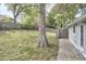 Large backyard featuring mature trees and a privacy fence at 918 Orient St, Durham, NC 27701