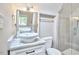 Bathroom featuring tiled shower and vanity with vessel sink at 918 Orient St, Durham, NC 27701