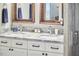 Bathroom with double marble sinks and vanity with dark hardware at 918 Orient St, Durham, NC 27701