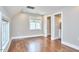 Bedroom with hardwood floors and an attached bathroom at 918 Orient St, Durham, NC 27701