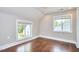 Bedroom features hardwood floors and two bright windows at 918 Orient St, Durham, NC 27701